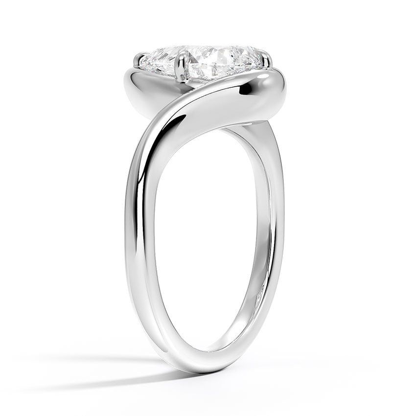 Ring setting side view in white gold, shown with a pear center stone