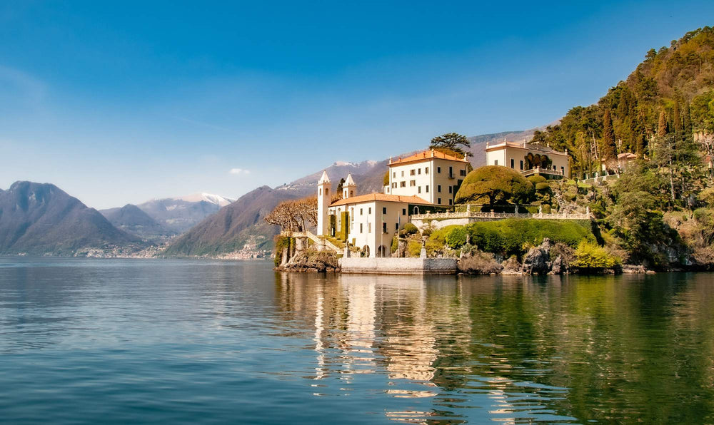 Still water beneath the villas of Lake Como